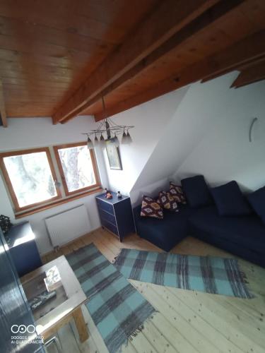 a living room with a couch and a table at Tőckés Vendégház in Pankasz