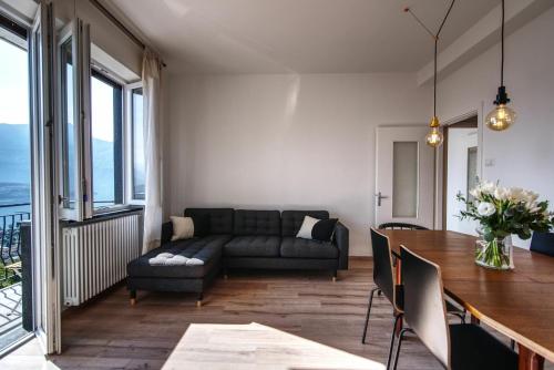a living room with a couch and a table at Ca Belee by Halldis in Vercana