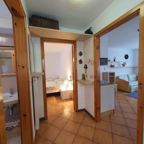 a room with a bedroom and a living room at NEGRITELLA in Alba di Canazei