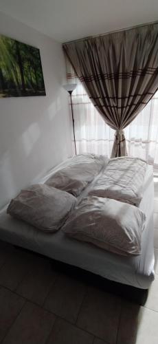 Krevet ili kreveti u jedinici u objektu Beau petit Appartement