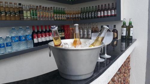 two bottles of champagne in a bucket on a bar at Recanto Familiar in Monte das Gameleiras