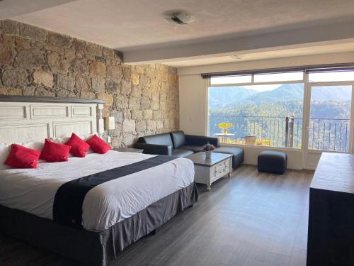 Postel nebo postele na pokoji v ubytování Vista Zacatlan Hotel