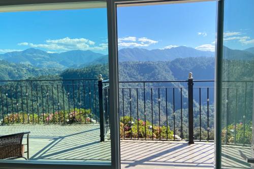 a balcony with a view of the mountains at Vista Zacatlan Hotel in Zacatlán