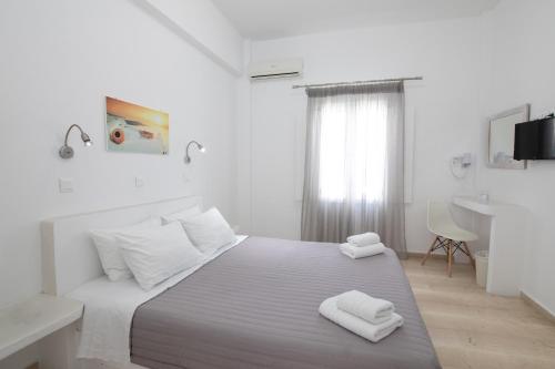 Ένα ή περισσότερα κρεβάτια σε δωμάτιο στο Evas House