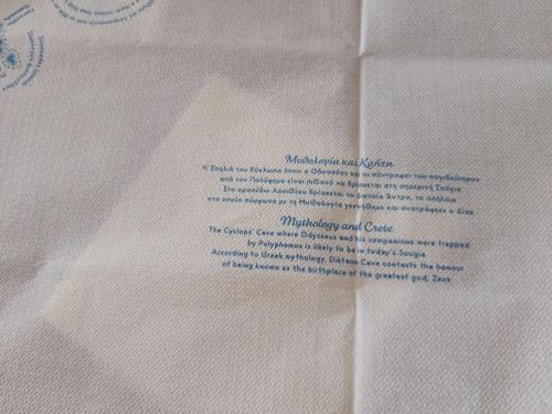 a piece of white paper with a letter on it at Rena's house in Pachia Ammos
