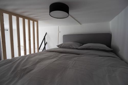 Кровать или кровати в номере Residence des Wetz Studios équipés - Centre-idéal Parc Expos
