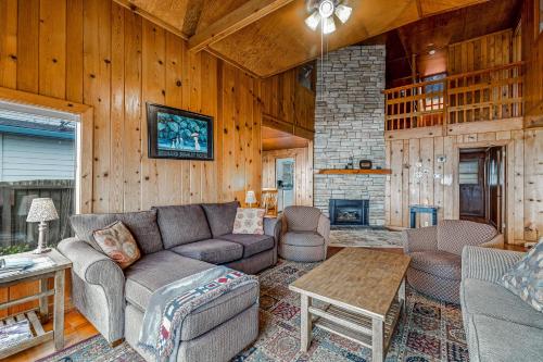 a living room with a couch and a table at Coastal Serenity in Lincoln City