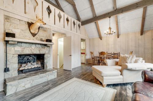 a living room with a couch and a fireplace at High Charter in Beech Mountain
