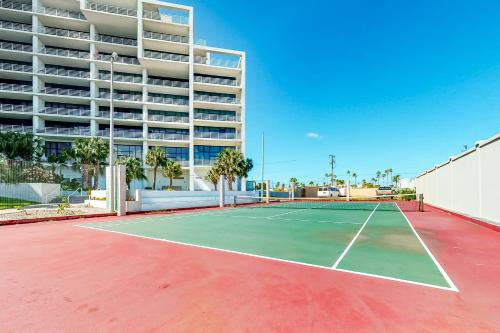 a tennis court in front of a building at Sunchase IV in South Padre Island