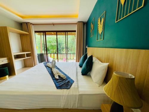 Postel nebo postele na pokoji v ubytování Phurin Thara Resort