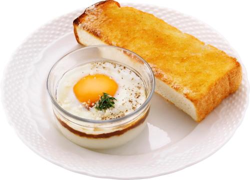 a plate of food with an egg and toast at Tokyu Stay Tsukiji - Tokyo Ginza Area in Tokyo