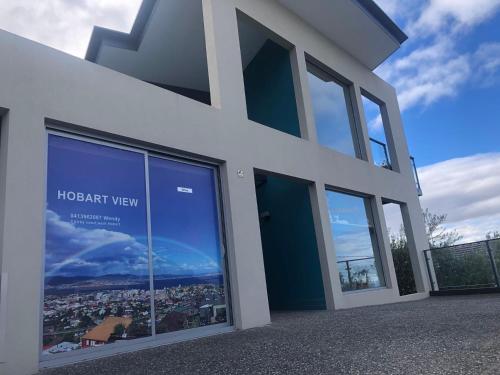 a building with large windows with a view of a city at Hobart View in Hobart