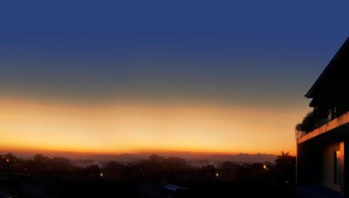 a view of the sunset from a building at Grand Sunshine Resort & Convention in Bandung