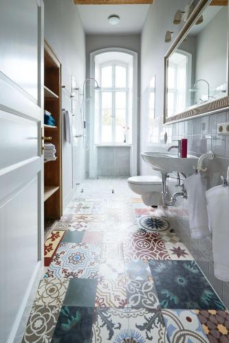 a bathroom with a sink and a tub at Gut Pohnstorf in Alt Sührkow