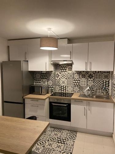 Photo de la galerie de l'établissement Au Saint-Hubert, Appartement 3 chambres Valenton, à Valenton