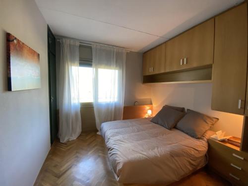 Gulta vai gultas numurā naktsmītnē Precioso Apartamento en La Molina