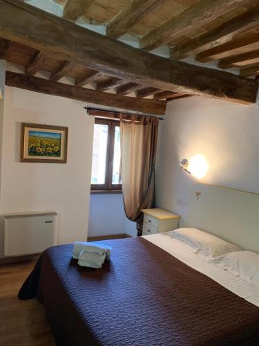 Postel nebo postele na pokoji v ubytování Residenza Via Dante