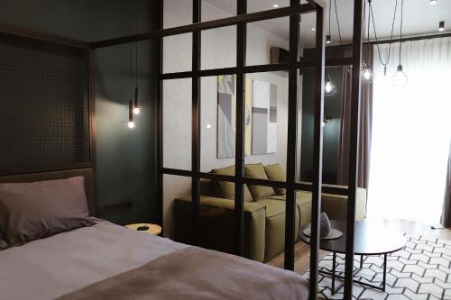 Postel nebo postele na pokoji v ubytování Kostjukowski brand-new apart-hotel
