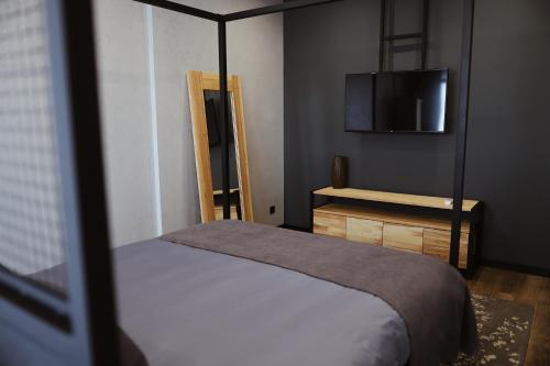Postel nebo postele na pokoji v ubytování Kostjukowski brand-new apart-hotel