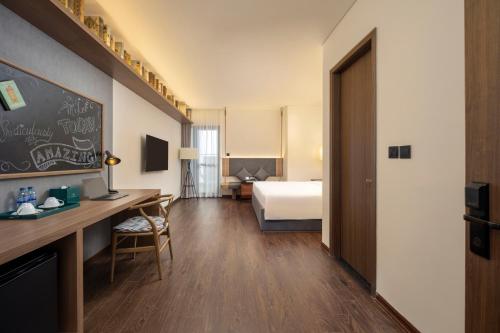 Ένα ή περισσότερα κρεβάτια σε δωμάτιο στο Mandala Hotel & Suites Bac Giang