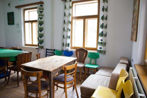 a dining room with a table and chairs at Turistická ubytovna U Tlusťocha in Malá Skála