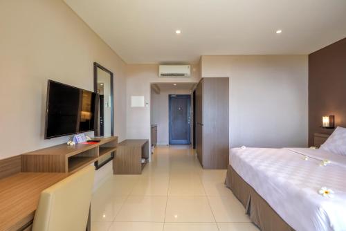 Mambruk Hotel & Conventionにあるベッド