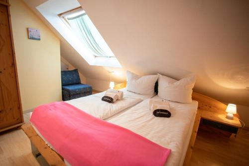 a bedroom with a large bed with two bags on it at Das Loft Hotel Willingen in Willingen