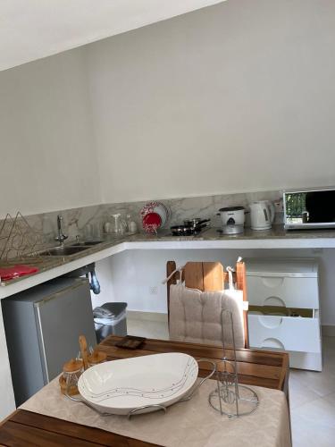 a kitchen with a table with a plate on it at SOUTH HILL VILLA in Mahe