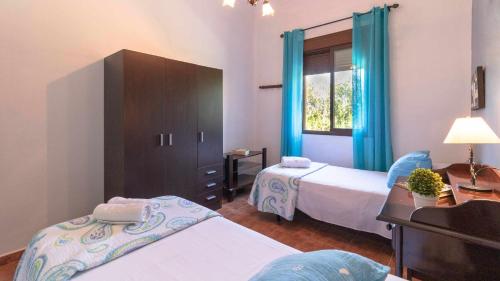 Posteľ alebo postele v izbe v ubytovaní Casa Rural Villa Lucrecia
