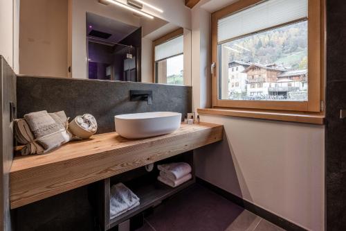 a bathroom with a sink and a window at Nidaris - Luxury Private Spa Suites in Malè