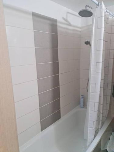 a bathroom with a shower with a glass door at מרחק נגיעה בתקווה in Petaẖ Tiqwa