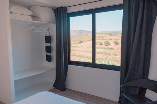 Ένα ή περισσότερα κρεβάτια σε δωμάτιο στο Casa do Losango - the Douro river as a border