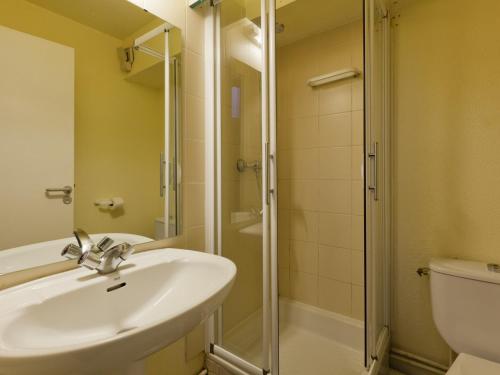 a bathroom with a sink and a shower and a toilet at Appartement La Tania, 4 pièces, 9 personnes - FR-1-513-8 in La Tania