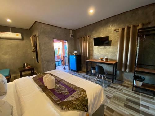TV a/nebo společenská místnost v ubytování Khum Lanna Boutique Hotel
