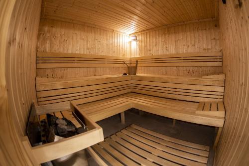an empty sauna with benches and a light in it at Hotel Karel IV. in Turnov