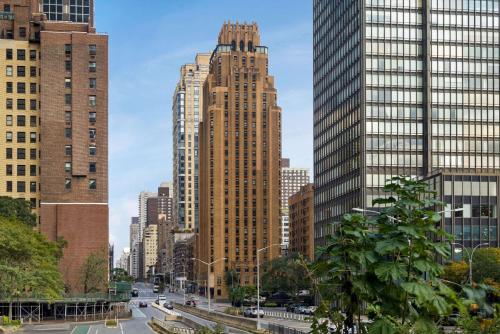 
a city street with tall buildings and tall buildings at The Beekman Tower, Trademark Collection by Wyndham in New York
