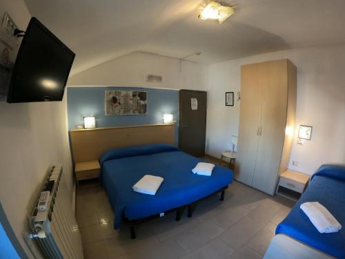 Ein Bett oder Betten in einem Zimmer der Unterkunft Albergo La Caravella