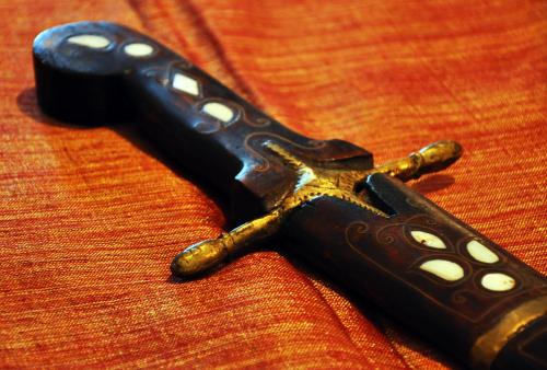 a black remote control sitting on top of a table at S.Nikolis' Historic Boutique Hotel in Rhodes Town