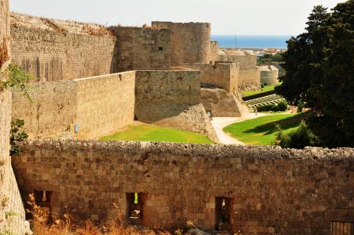 a view of the walls of a castle at S.Nikolis' Historic Boutique Hotel in Rhodes Town