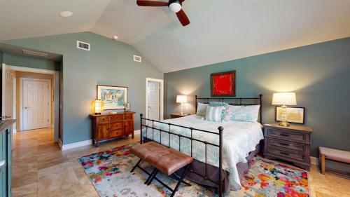 a bedroom with a bed and a ceiling fan at 2 Off Shore in Hilton Head Island