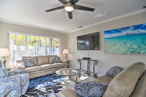 a living room with a couch and a ceiling fan at Indian Rocks Beach Home - 2 Blocks to Beach! in Clearwater Beach
