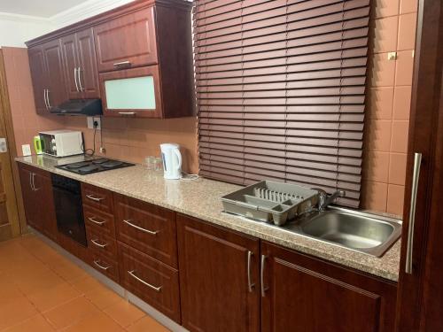 a kitchen with a sink and a counter top at San Lameer Holidays in Southbroom