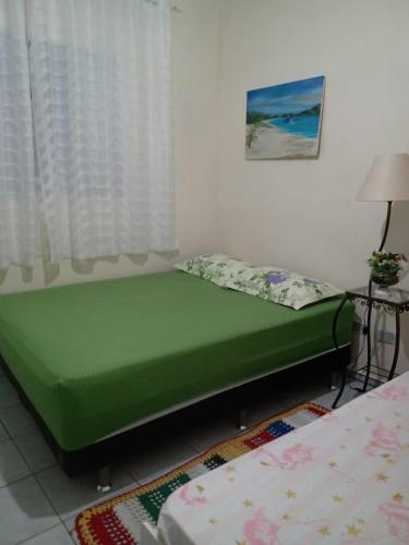Een bed of bedden in een kamer bij Casa de Férias