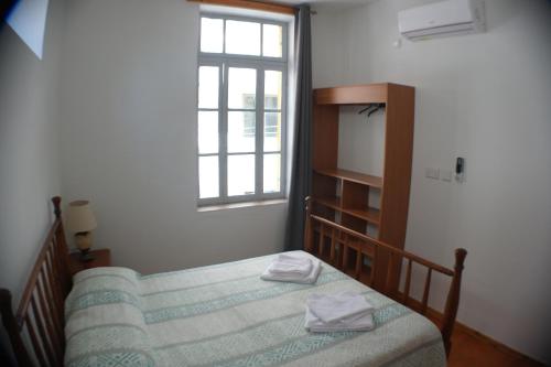 Postel nebo postele na pokoji v ubytování Harrys Inn Guesthouse
