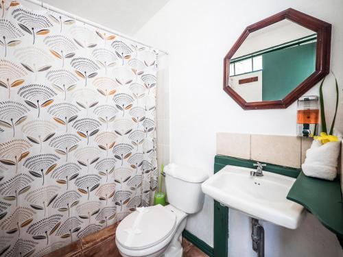 a bathroom with a toilet and a sink at La Puesta del Sol B&B in Carrillo