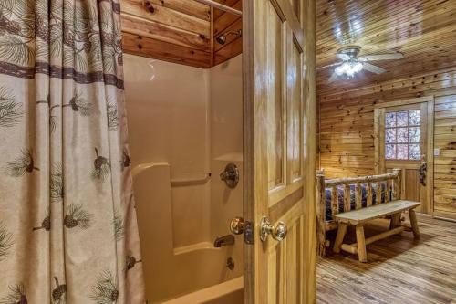 a bathroom with a shower and a walk in shower at The Nut House, Hot Tub, Game Room, WIFI, 560 FREE tickets each paid day in Pigeon Forge