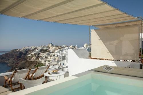a view from the balcony of a villa at Gabbiano Traditional Cave Houses in Oia
