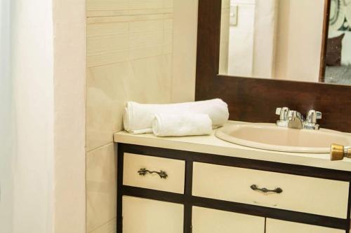 a bathroom with a sink and a mirror at Casa Grande in San Miguel