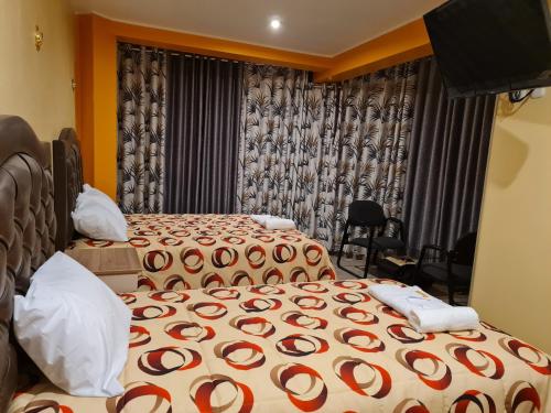 Ένα ή περισσότερα κρεβάτια σε δωμάτιο στο Hostal Tuki Huancayo