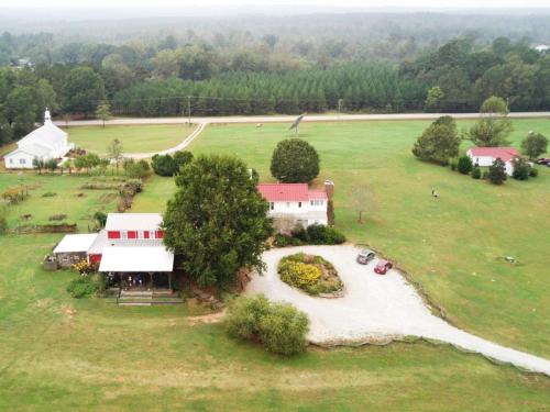 an aerial view of a house in a field at The Farmhouse Inn in Madison